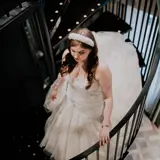 bride walking up staircase in honeymoon suite