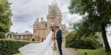 Couple kissing with Castle in the background