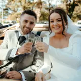 couple drinking champagne during brisbane wedding