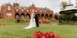 Couple kissing in the gardens of Boclair House